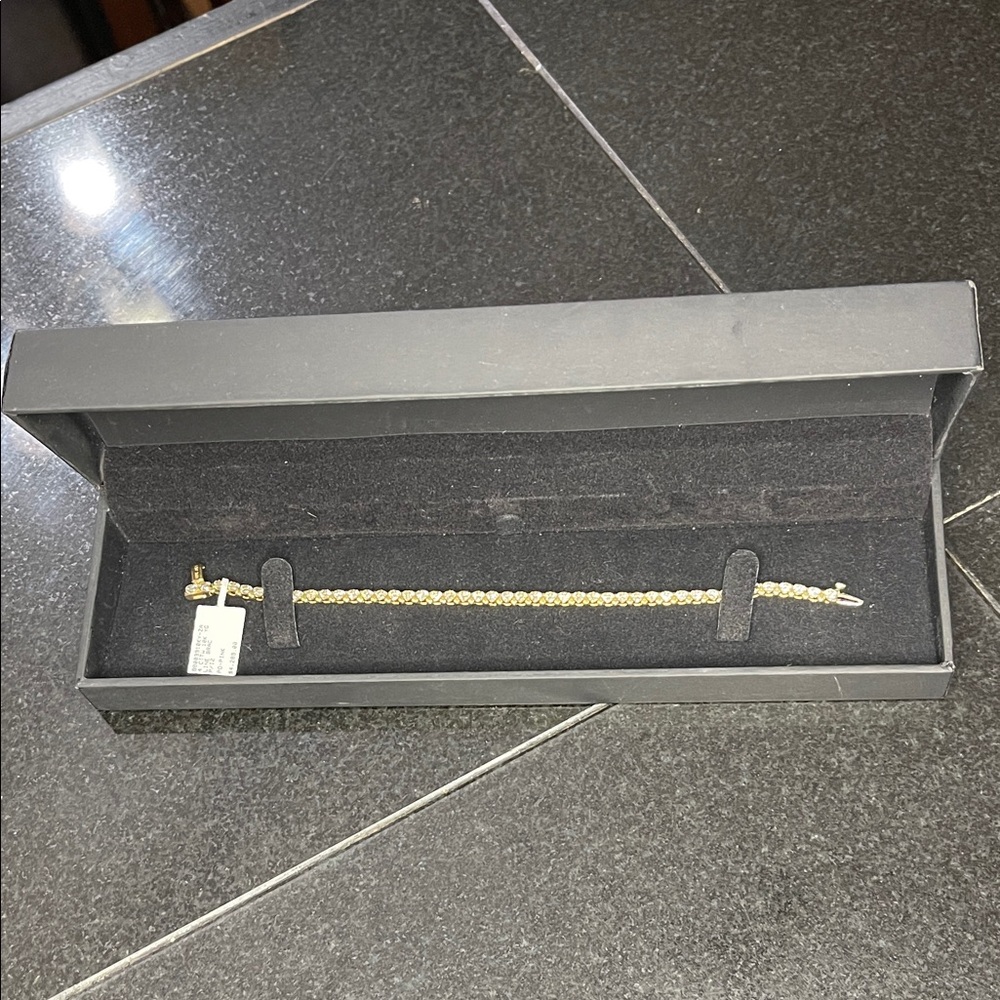 4 Carat Diamond Bracelet set in 10K Gold in original black Zales box.